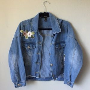 Light wash jean jacket with embroidered flowers